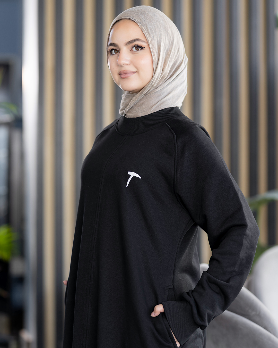 Long loose melton modest dress in black, close-up